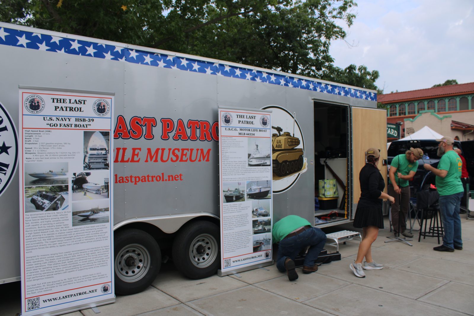 The Last Patrol Mobile Museum trailer with its printed wrap, set up at a community event