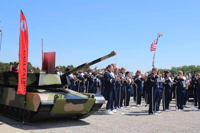 Lil Abe parked beside a high school marching band on Memorial Day