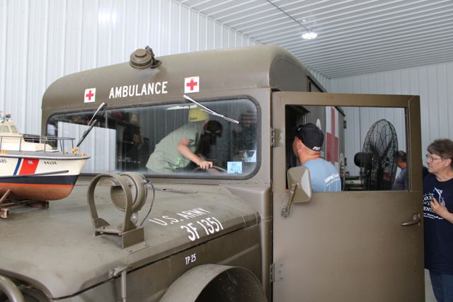 The Kaiser Jeep M725 ambulance parked inside the shop