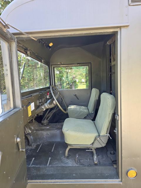 The cab of the M725 ambulance with its bench seat and controls
