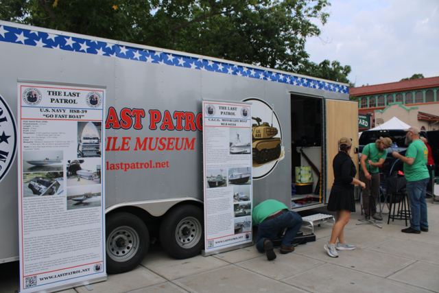 The Last Patrol Mobile Museum trailer with its printed wrap, set up at an event