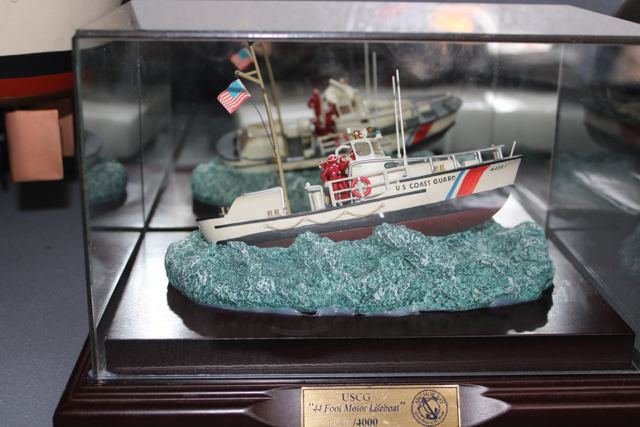 A cased numbered-edition model of a Coast Guard 44-foot motor lifeboat