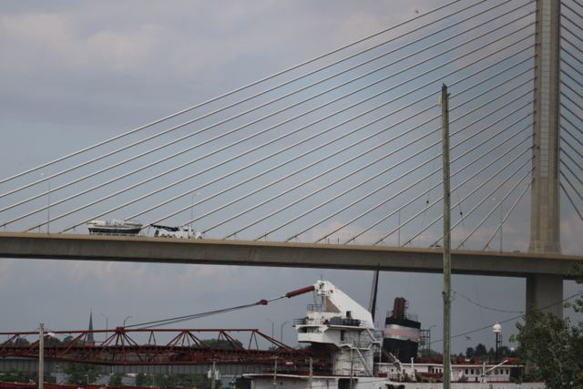 MLB 44334 crossing the Veterans’ Glass City Skyway with a lake freighter below