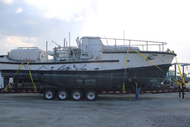 MLB 44334 strapped down on the trailer at the marina