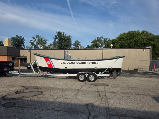 The 26-foot motor surf boat marked U.S. Coast Guard Retired on its trailer