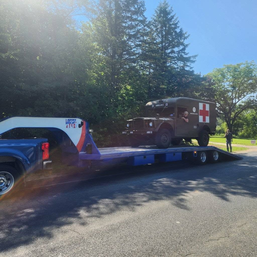 The Vietnam-era M725 ambulance arriving on a transport trailer