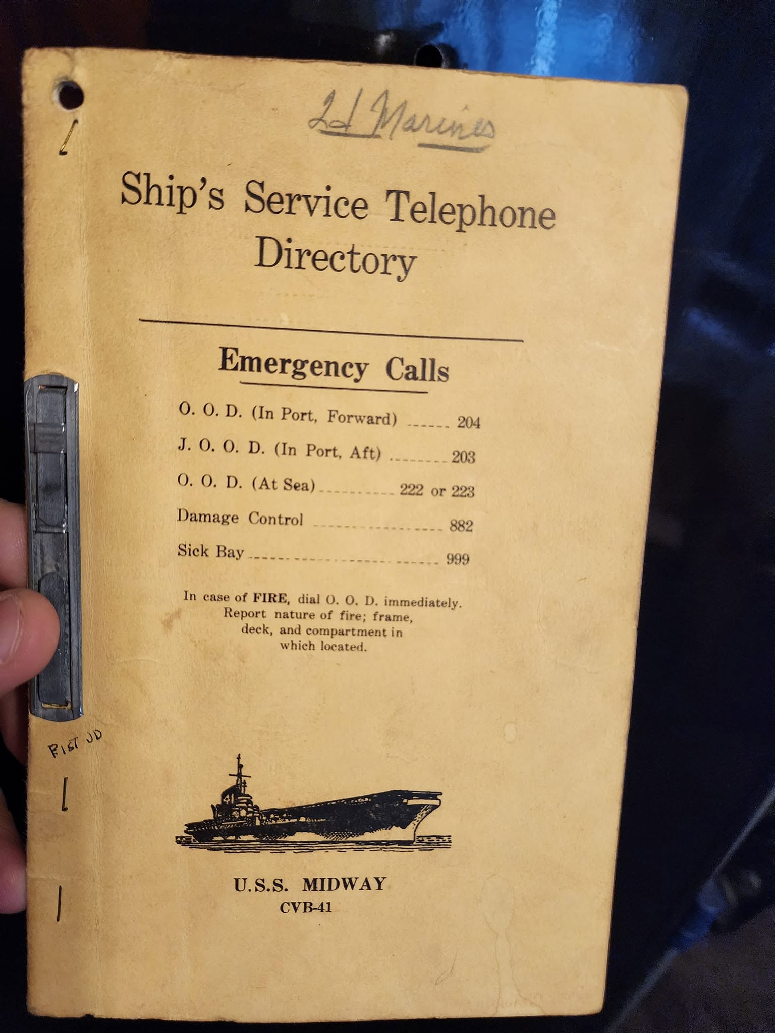 A ship's service telephone directory from USS Midway CVB-41, held by a collection volunteer
